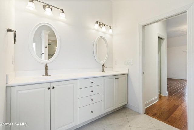 bathroom with vanity and wood-type flooring