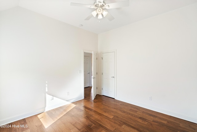 spare room featuring hardwood / wood-style flooring, ceiling fan, and lofted ceiling