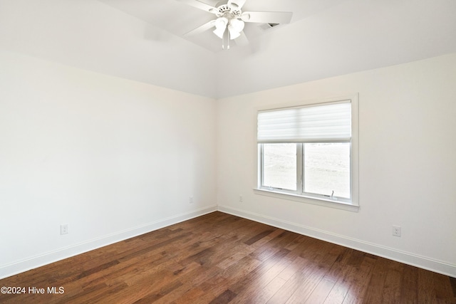 unfurnished room with ceiling fan and dark wood-type flooring