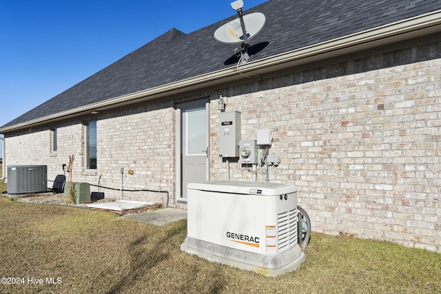 exterior space featuring a lawn and cooling unit