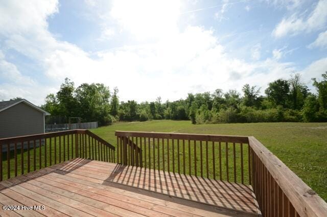 deck featuring a yard