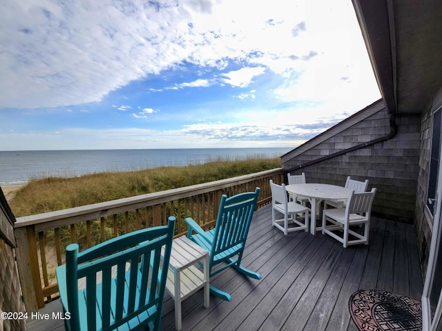 wooden deck featuring a water view