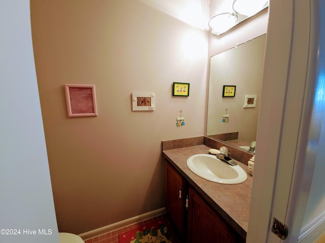 bathroom with tile patterned flooring and vanity