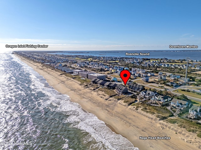 aerial view featuring a water view and a view of the beach