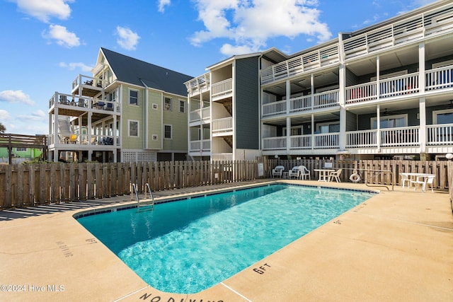 view of swimming pool with a patio area