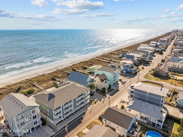 bird's eye view featuring a water view and a view of the beach