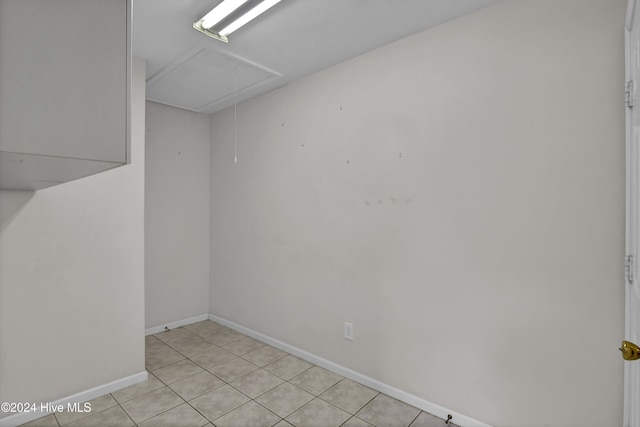 unfurnished room with light tile patterned floors