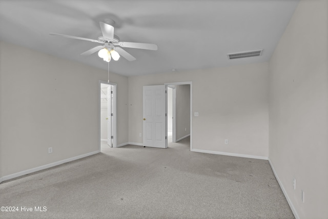 empty room with light carpet and ceiling fan