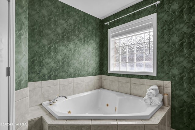 bathroom with tiled bath