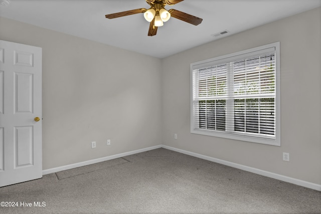 spare room with carpet flooring and ceiling fan