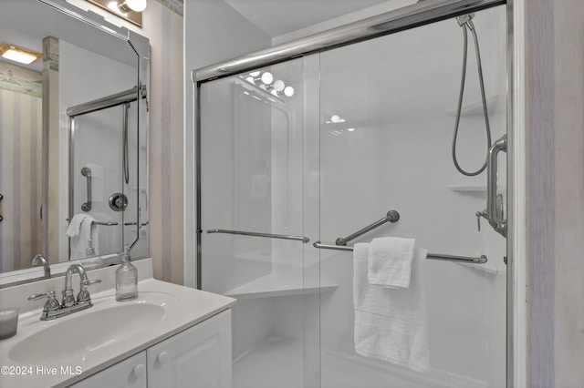 bathroom with vanity and an enclosed shower