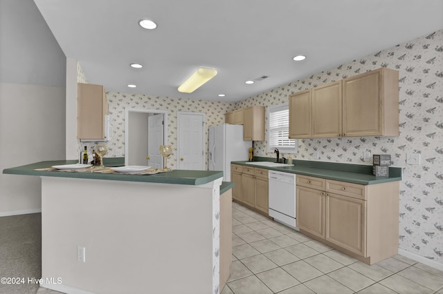 kitchen featuring white appliances, sink, light brown cabinetry, light tile patterned flooring, and kitchen peninsula