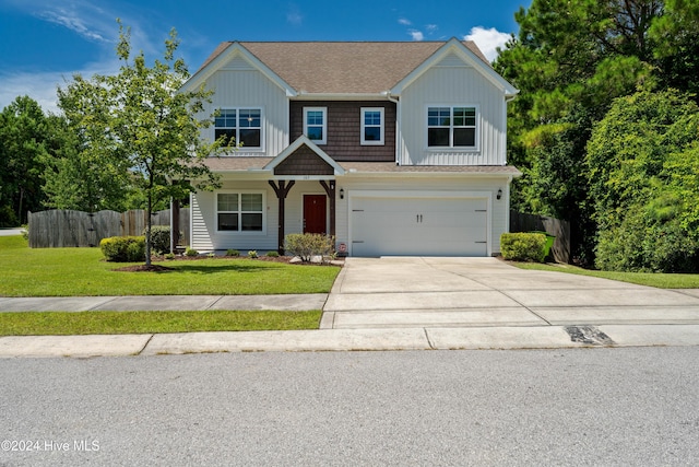 view of front of home with a garage and a front yard