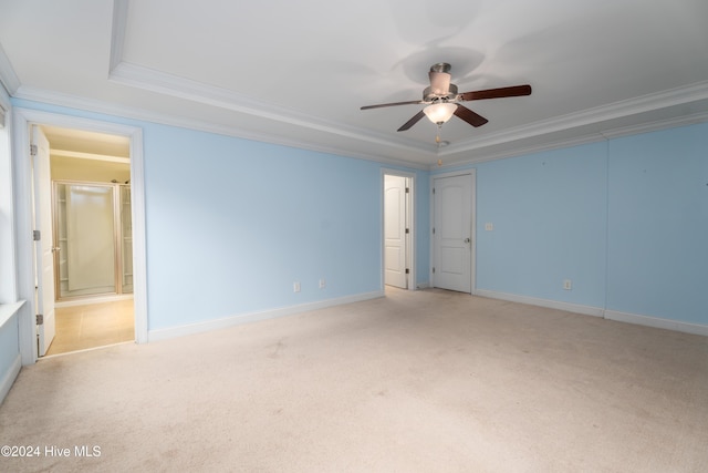 carpeted spare room with crown molding and ceiling fan