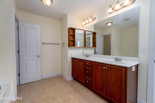 bathroom featuring tile patterned flooring and vanity