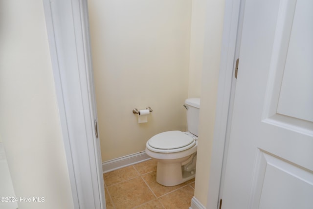 bathroom with tile patterned floors and toilet