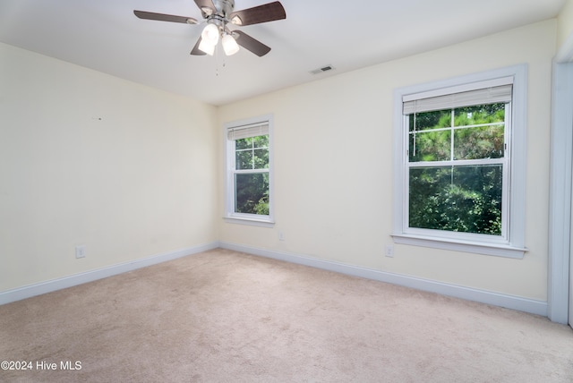 carpeted empty room with ceiling fan