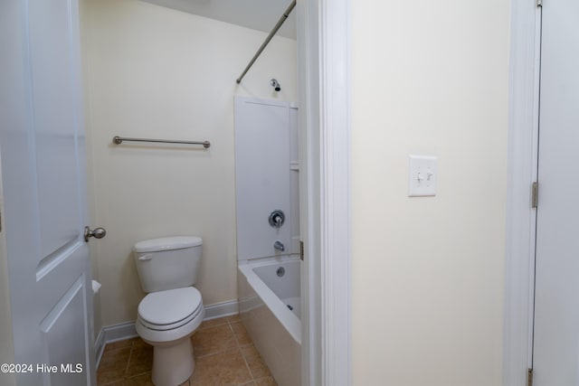 bathroom featuring tile patterned floors, shower / bathtub combination, and toilet