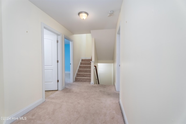 hallway with light carpet