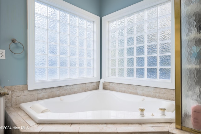 bathroom with tiled tub