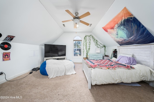 carpeted bedroom with vaulted ceiling and ceiling fan