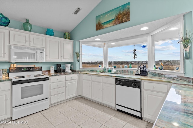 kitchen featuring white cabinets, white appliances, and plenty of natural light