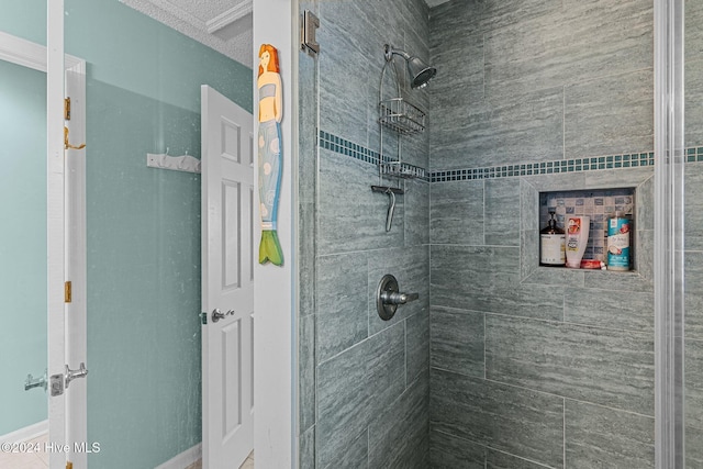 bathroom with a tile shower