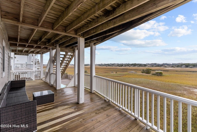 wooden deck featuring a rural view