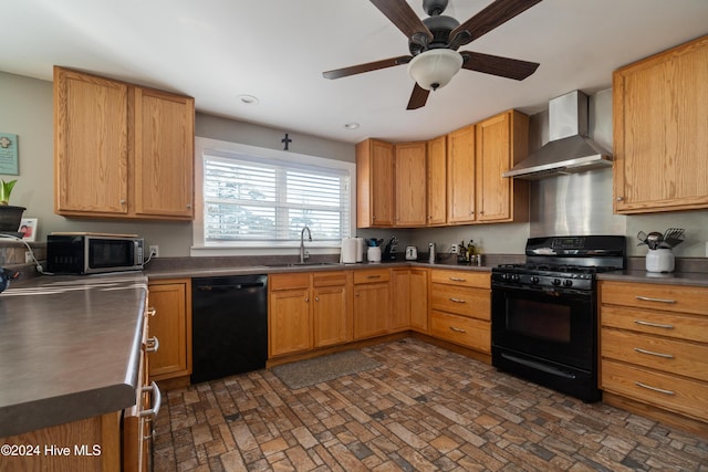 kitchen with black appliances, wall chimney exhaust hood, ceiling fan, and sink