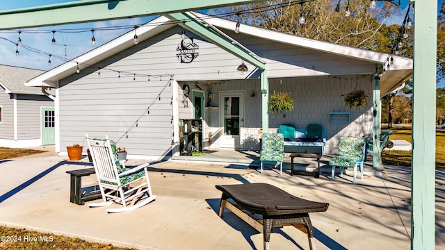 back of property featuring a patio area