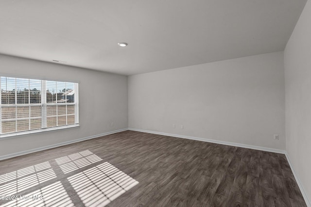 empty room featuring dark wood-type flooring