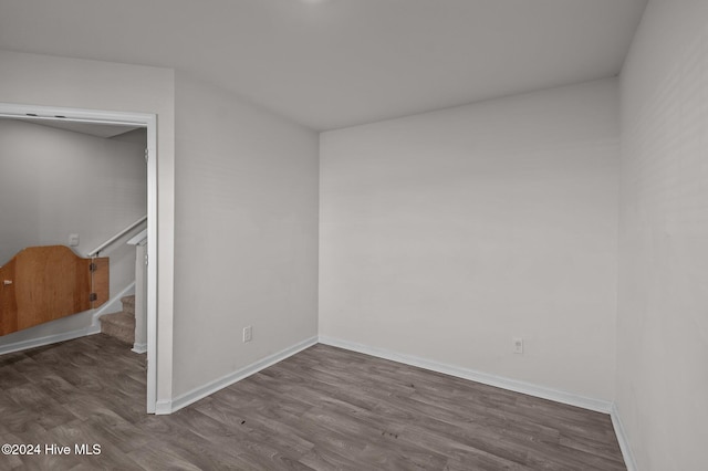 empty room with dark wood-type flooring