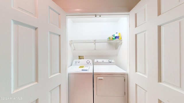 washroom featuring washer and clothes dryer