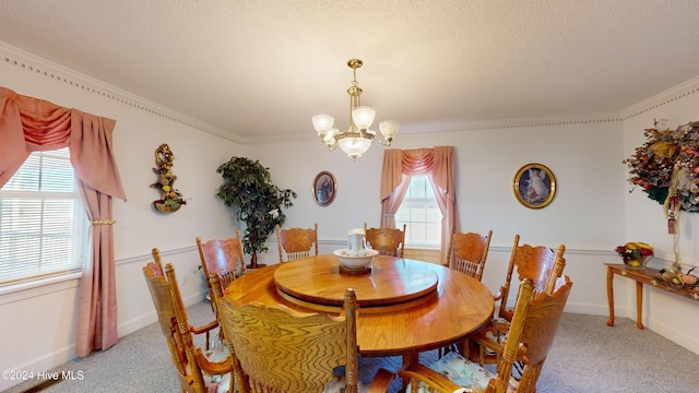 dining area with crown molding, carpet floors, a textured ceiling, and an inviting chandelier