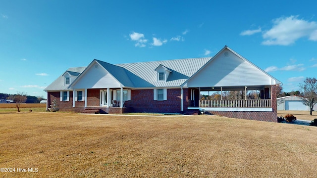 view of front of property with covered porch and a front lawn