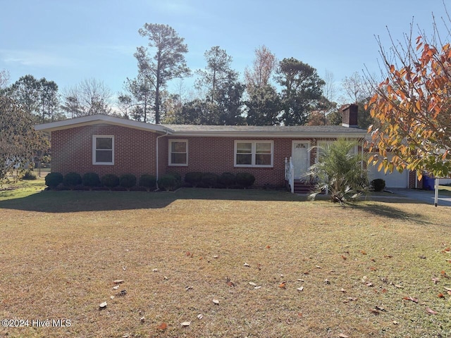 ranch-style home with a front lawn