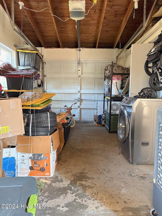 garage with washer / dryer and a garage door opener