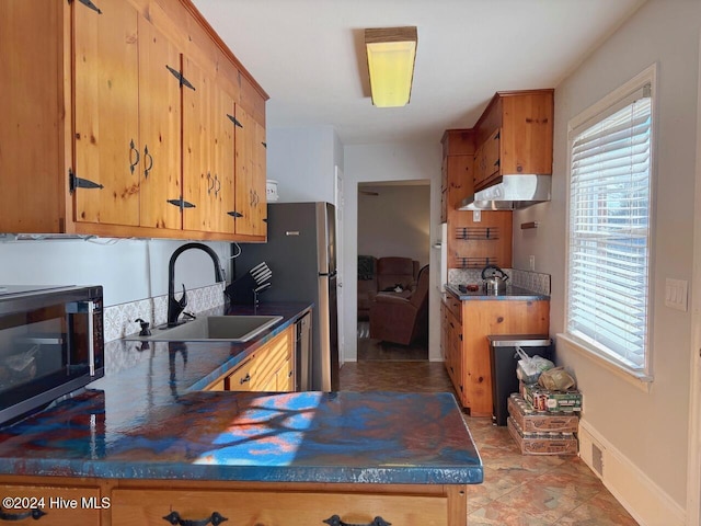 kitchen featuring sink and appliances with stainless steel finishes