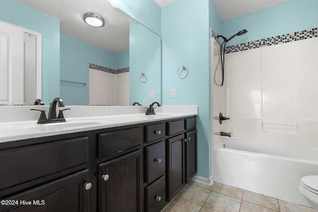 full bathroom featuring tile patterned floors, toilet, vanity, and tub / shower combination