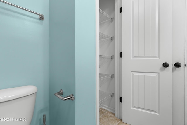 bathroom featuring tile patterned flooring and toilet