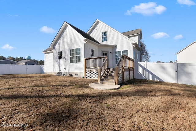 back of house with a yard and a deck