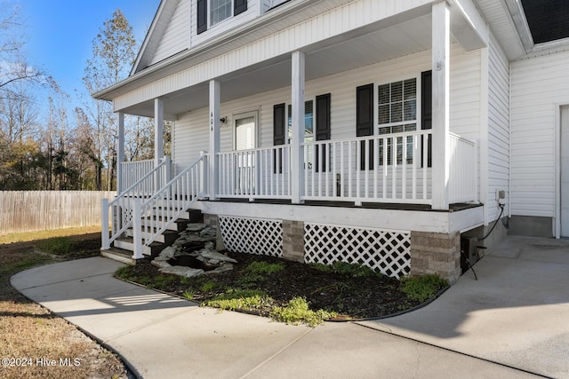 doorway to property with covered porch