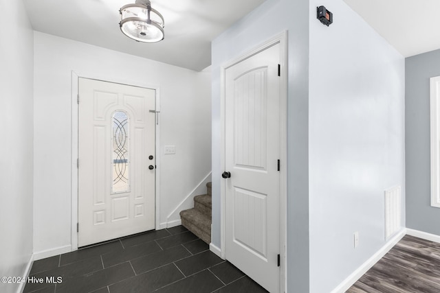 foyer featuring dark wood-type flooring