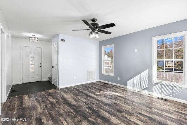 interior space featuring dark hardwood / wood-style floors, ceiling fan, and a wealth of natural light