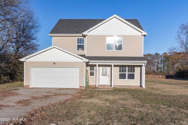 front facade with a front lawn and a garage