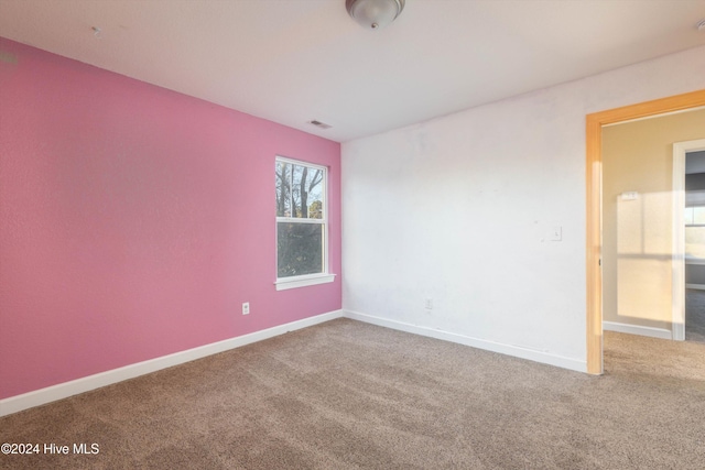 unfurnished room with carpet flooring