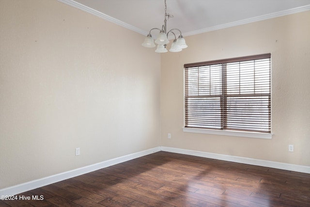 unfurnished room with dark hardwood / wood-style floors, crown molding, and a notable chandelier