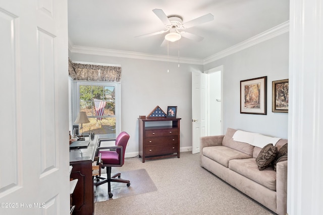 carpeted home office featuring ceiling fan and crown molding