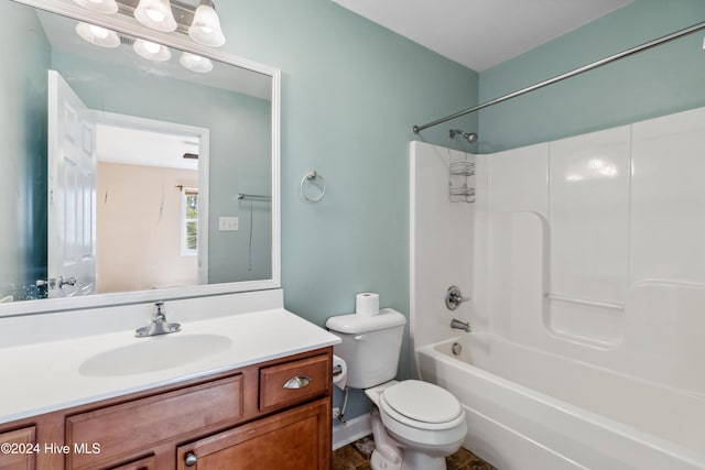 full bathroom with bathtub / shower combination, vanity, and toilet