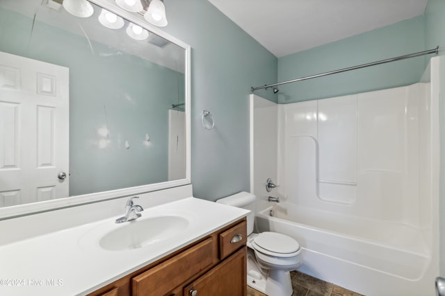 full bathroom with shower / bathing tub combination, vanity, and toilet